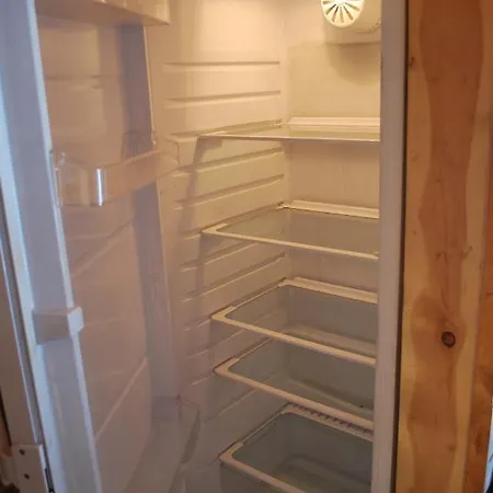 بيت خشبي Northern Lights Opposite The Mountains