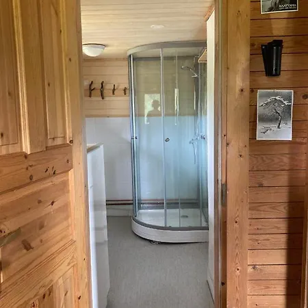 بيت خشبي Northern Lights Opposite The Mountains *