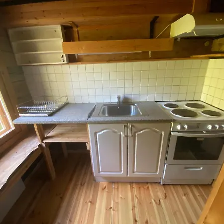 بيت خشبي Northern Lights Opposite The Mountains *